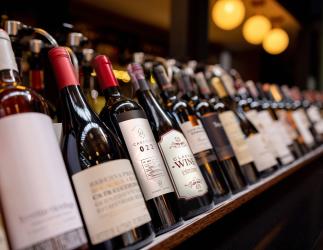 a series of wine bottles on a shelf