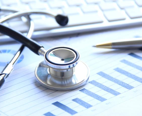 Stethoscope next to a graph. 