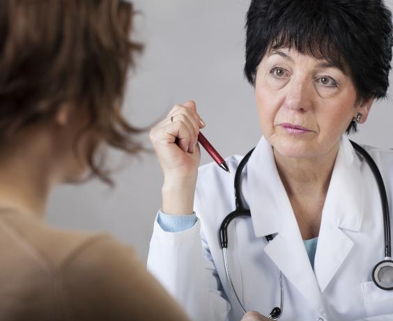 A healthcare provider is listening to a patient.
