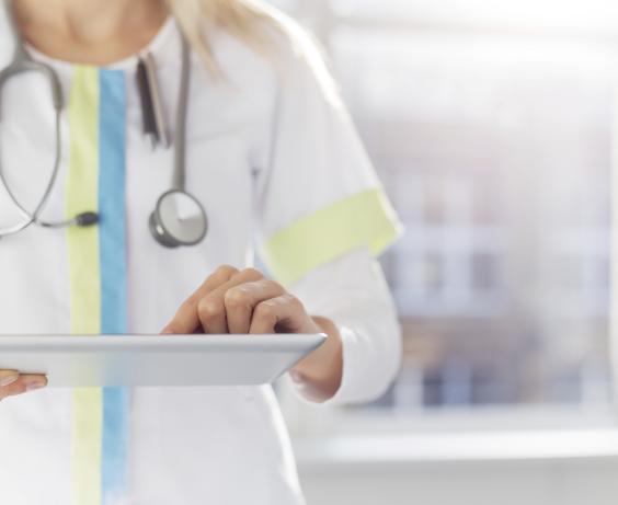 Healthcare provider holding a clipboard.